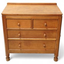 Mouseman - Oak chest of drawers, rectangular adzed top with raised gallery, two short over two long drawers with turned handles, raised on octangonal supports, carved mouse to the right edge, by the workshop of Robert Thompson, Kilburn.

Provenance - this lot comes to us for sale from direct descent of Robert Thompson. Thompson is the great grandfather of the vendor