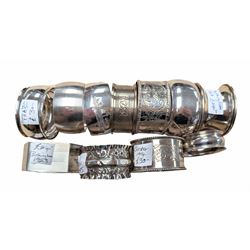 Eleven silver napkin rings, of varying styles and design, mostly hallmarked