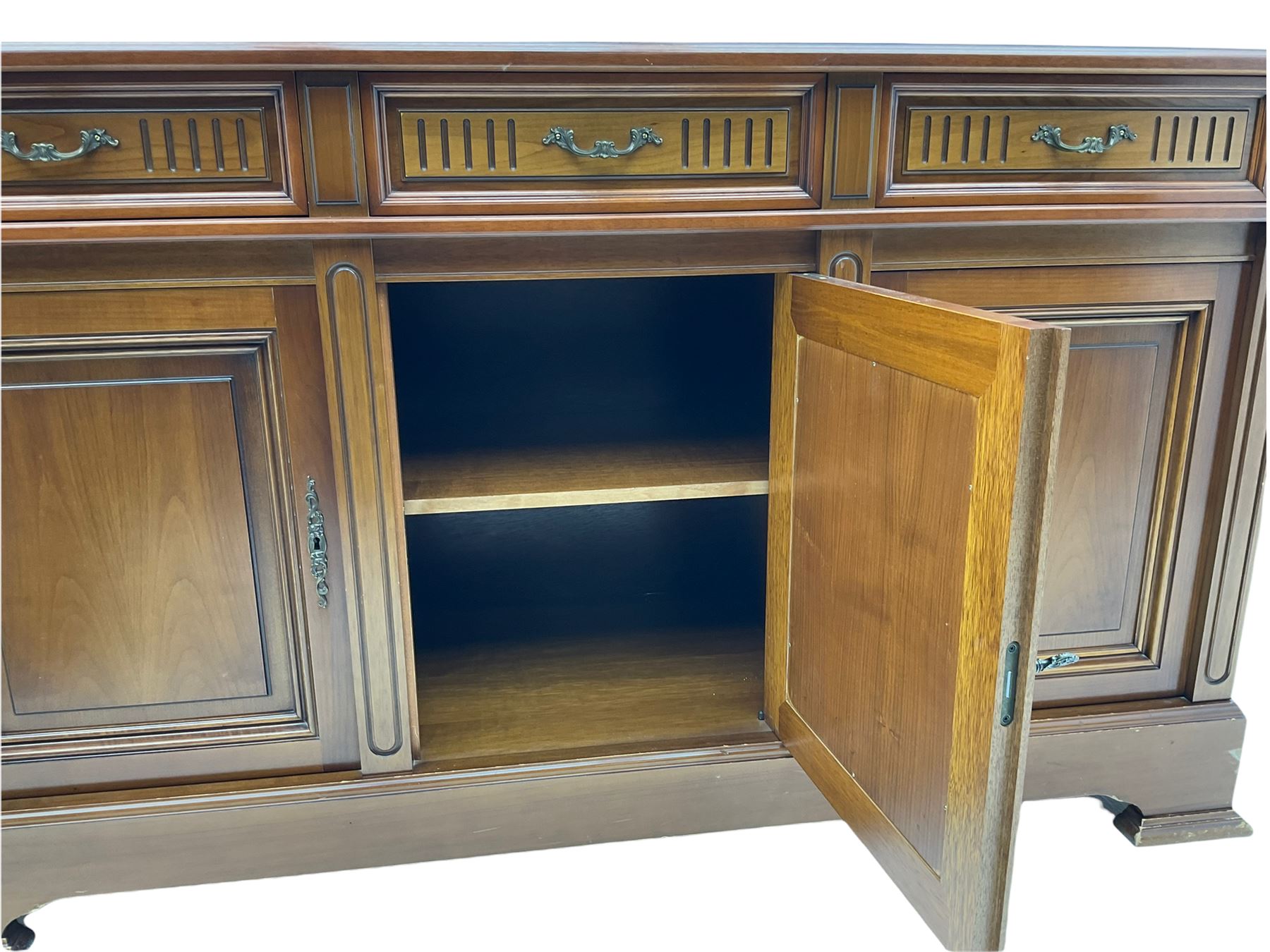Contemporary cherry wood sideboard, rectangular moulded top over three drawers and three cupboards