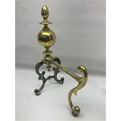 Pair of early 20th century brass fire dogs, each with sphere and urn finial, upon a scrolling base, H38cm