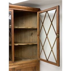 Large late 19th century sycamore corner cabinet, the top section with two astragal glazed doors enclosing two shaped shelves, the lower section enclosed by two panelled doors with square spandrels, W128cm, H215cm