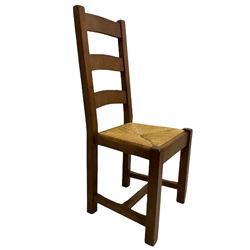Antix French oak dining table with two leaves, two frieze drawers;, and six ladder back chairs with rush seats