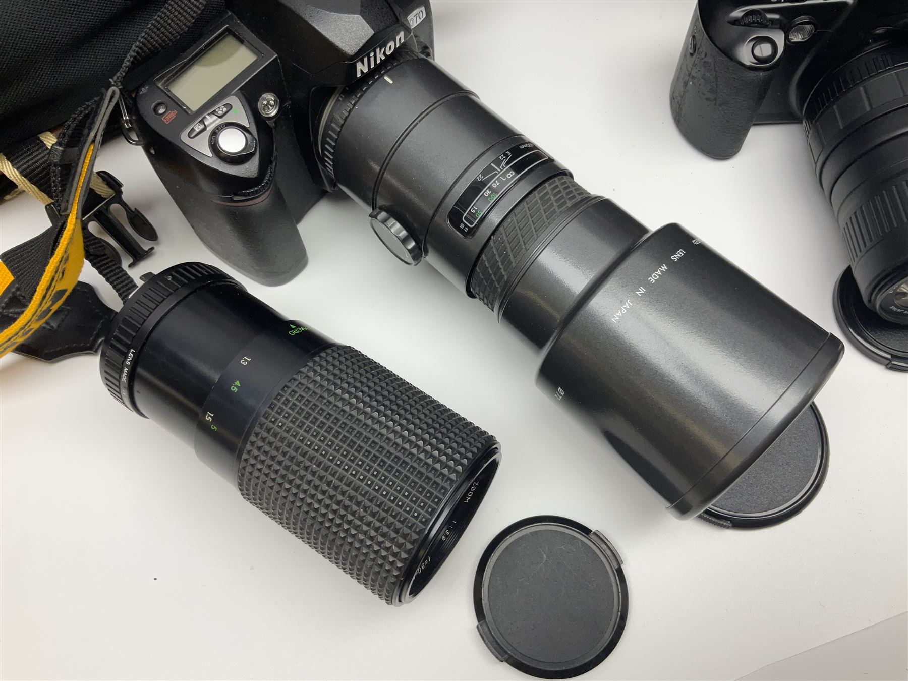 Four camera bodies, to include, Ricoh KR-10 serial no. 38826, Pentax MZ-M serial no. 4185969 with 'SMC Pentax- M 1:3.5 28mm' lens, Canon EOS500 serial no. 080927, with 'Sigma Zoom 100-300mm 1:4.5-6.7 DL'  lens etc, with other camera lenses and equipment 