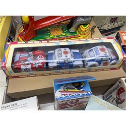 Twenty six tinplate models to include Ferris Wheel and Performing Circus Elephant, marked JW, further similar examples such as Duck on a Bike, Clown on Roller, Carousel; Popeye Tin Speedboat; Looney Tunes Wind Up Cars and Express Train; various international examples, MS107 Jumping Bambi, Pop Pop Boat, jumping frogs, pecking chickens etc; both boxed and loose