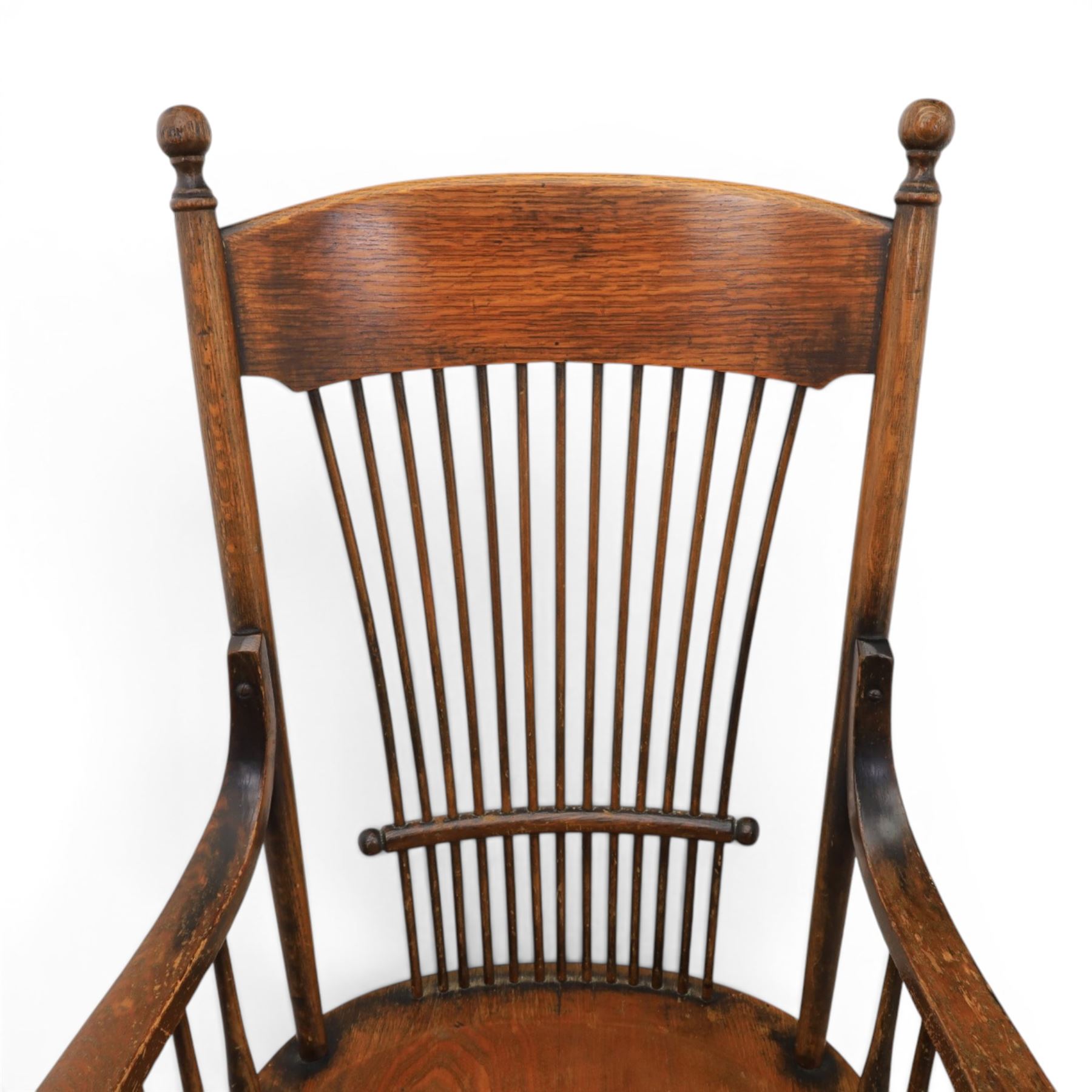 Set of eight 19th century ash and elm spindle back Windsor armchairs, arched top rails above fan-shaped spindle backs, curved arms with turned supports, shaped saddle seats, on turned legs joined by H-stretchers