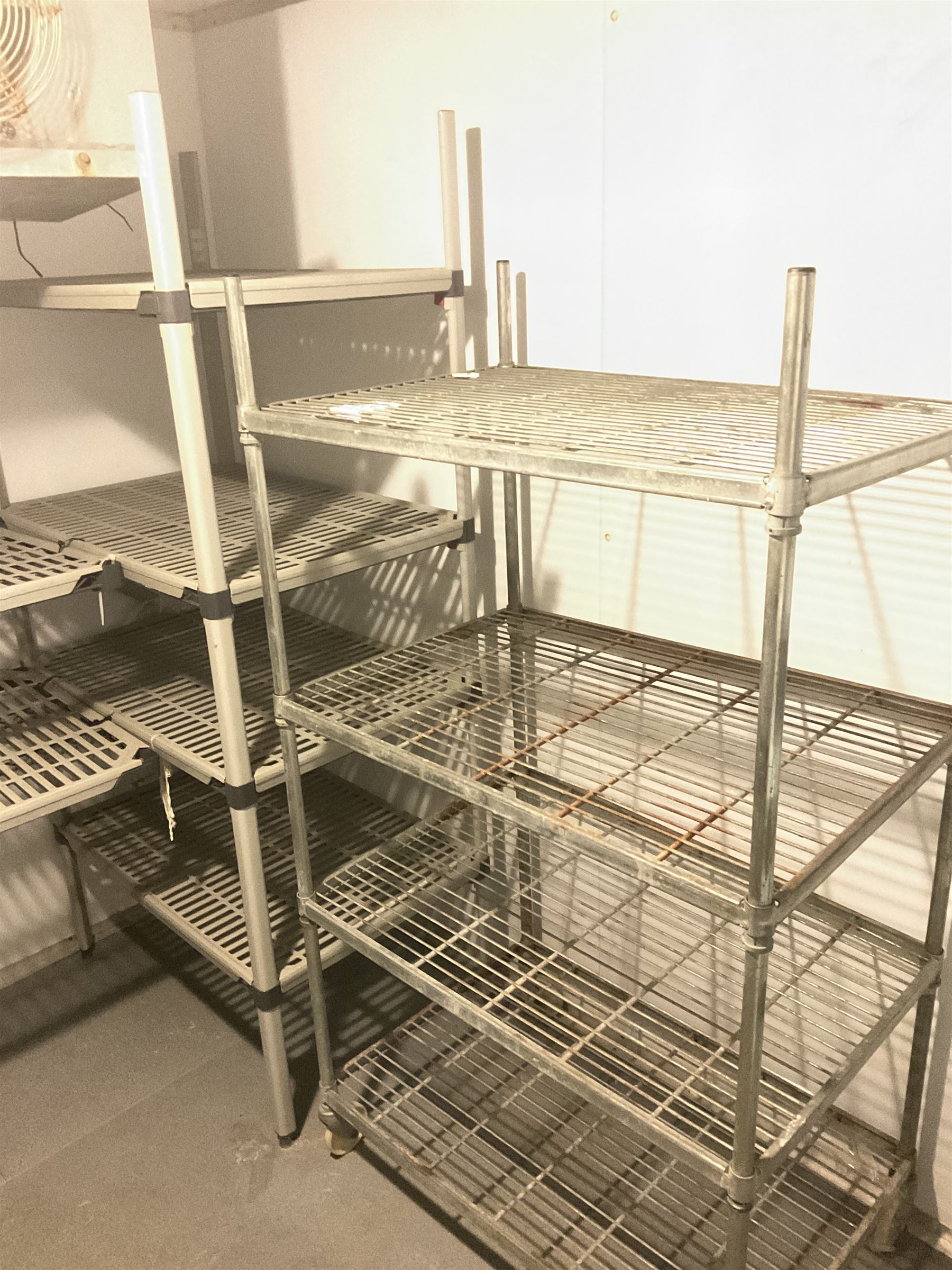 Metal four tier shelving racking x 3, plastic racking and shelving- LOT SUBJECT TO VAT ON THE HAMMER PRICE - To be collected by appointment from The Ambassador Hotel, 36-38 Esplanade, Scarborough YO11 2AY. ALL GOODS MUST BE REMOVED BY WEDNESDAY 15TH JUNE.