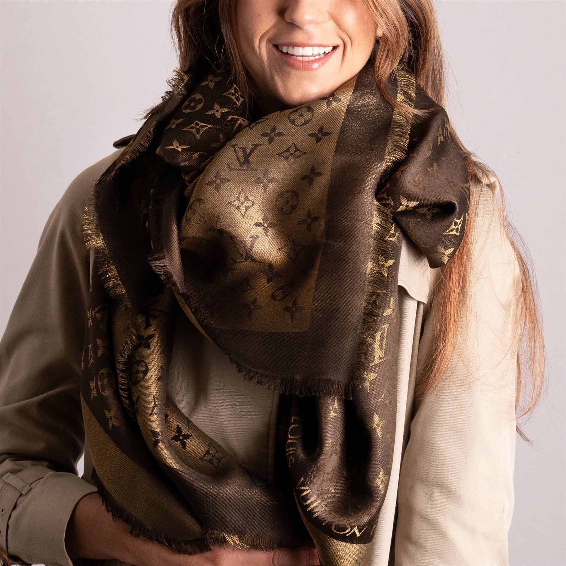 Louis Vuitton – a monogram silk and wool blend shawl in brown and gold, with fringe, 140cm x 140cm, unused with original box