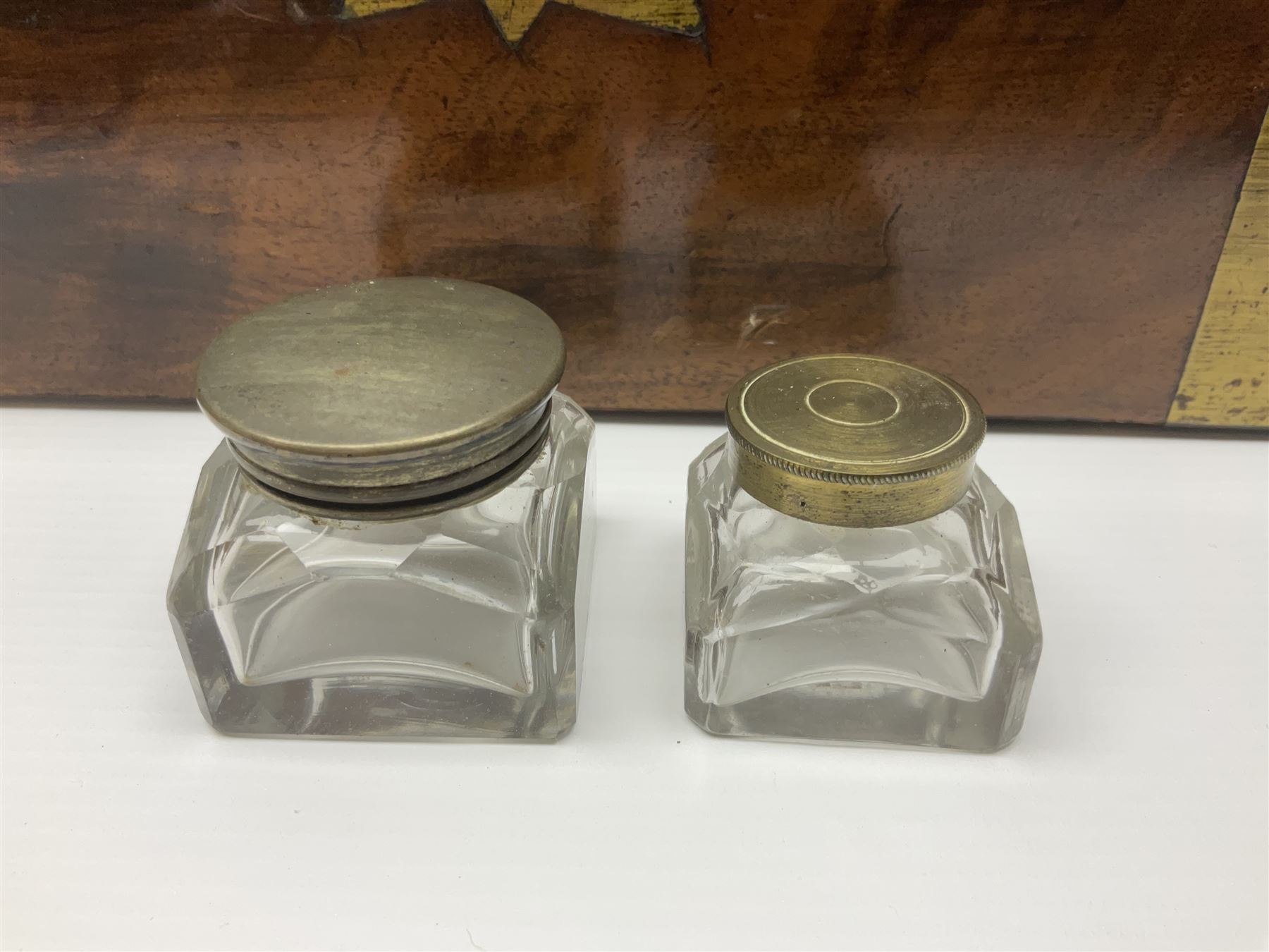 Victorian mahogany writing slope, the brass bound hinged cover opening to reveal tooled leather and gilt interior with two glass inkwells, together with a similar parquetry inlaid writing slope, with central mother of pearl inlay enrgraved 'Sarah', tallest H17cm 