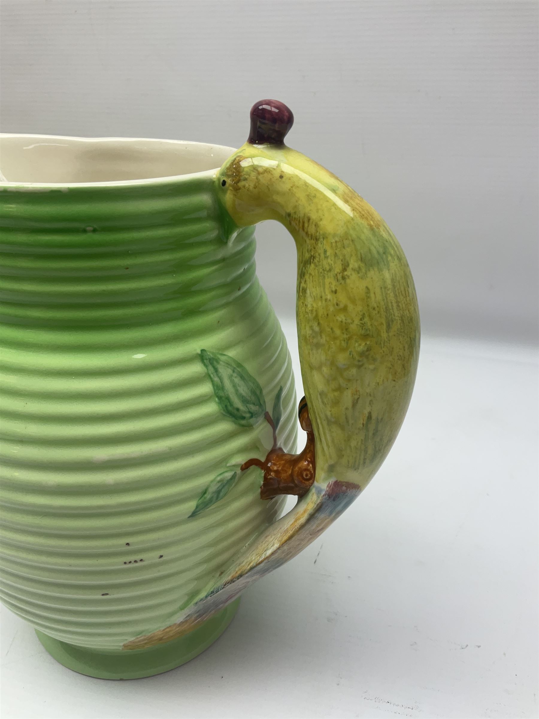 Collection of 1930s ceramics, comprising Shorter & Son jug with bird handle, set of three J.H.W & Sons graduating jugs, Clarice Cliff My Garden pattern vase and Celtic Harvest pattern cake plate and a Burleigh Ware sandwich plate set, bird jug H21cm