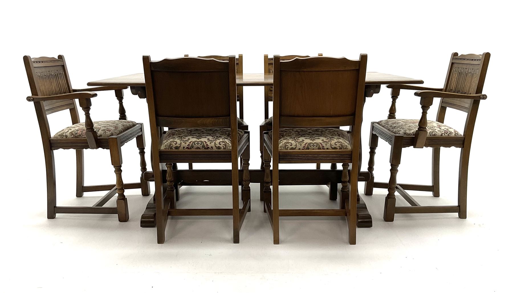 Old Charm - medium oak dining table, rectangular top on lyre shaped supports (153cm x 82cm, H75cm), and six (4+2) matching dining chairs with linen fold panelled backs
