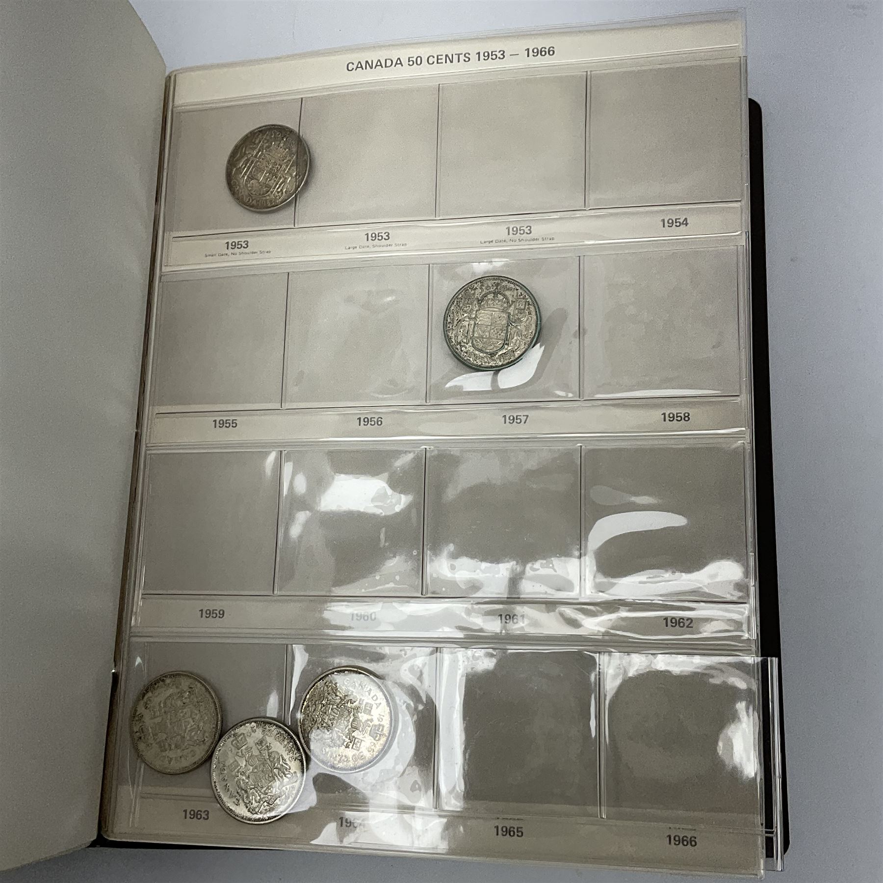 Mostly Canadian coins including 1967 six coin set, various Canadian 50 cent coins, various nickels, Royal Canadian Mint 1990 specimen coin set in blue folder with outer sleeve, various Canadian dollars etc, in folders and loose