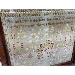 Victorian needlework sampler, depicting a band of alphabet and numbers, above verse detailed 'The heavens declare the glory of God and the firmament sheweth his handywork', with floral and foliate motifs below, worked by Isabella Summers, aged fourteen, dated 1869, framed, frame H58cm

