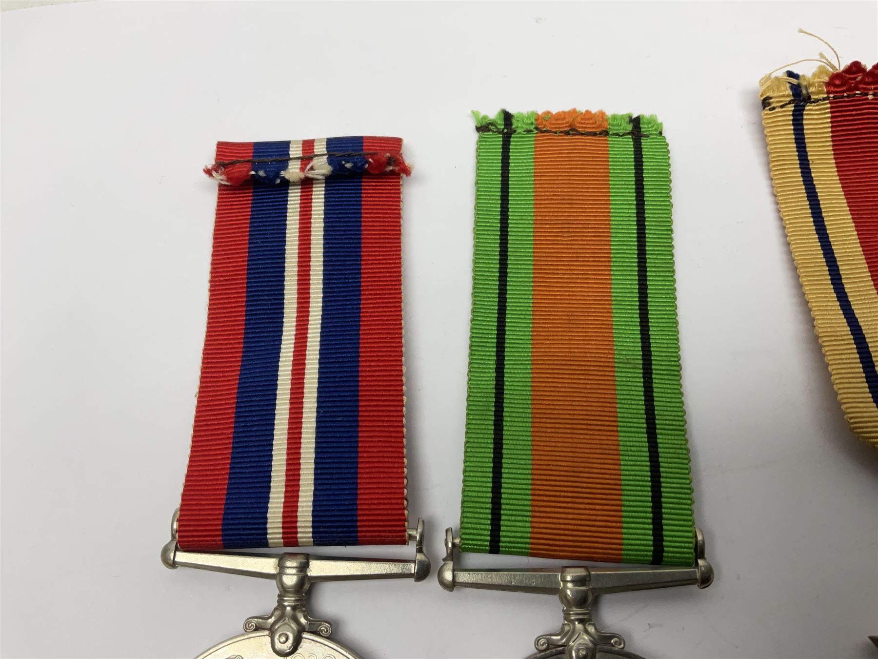 Group of five WWII medals comprising 1939-45 War Medal, Defence Medal and Italy, Africa and 1939-45 Stars; all with ribbons (5)