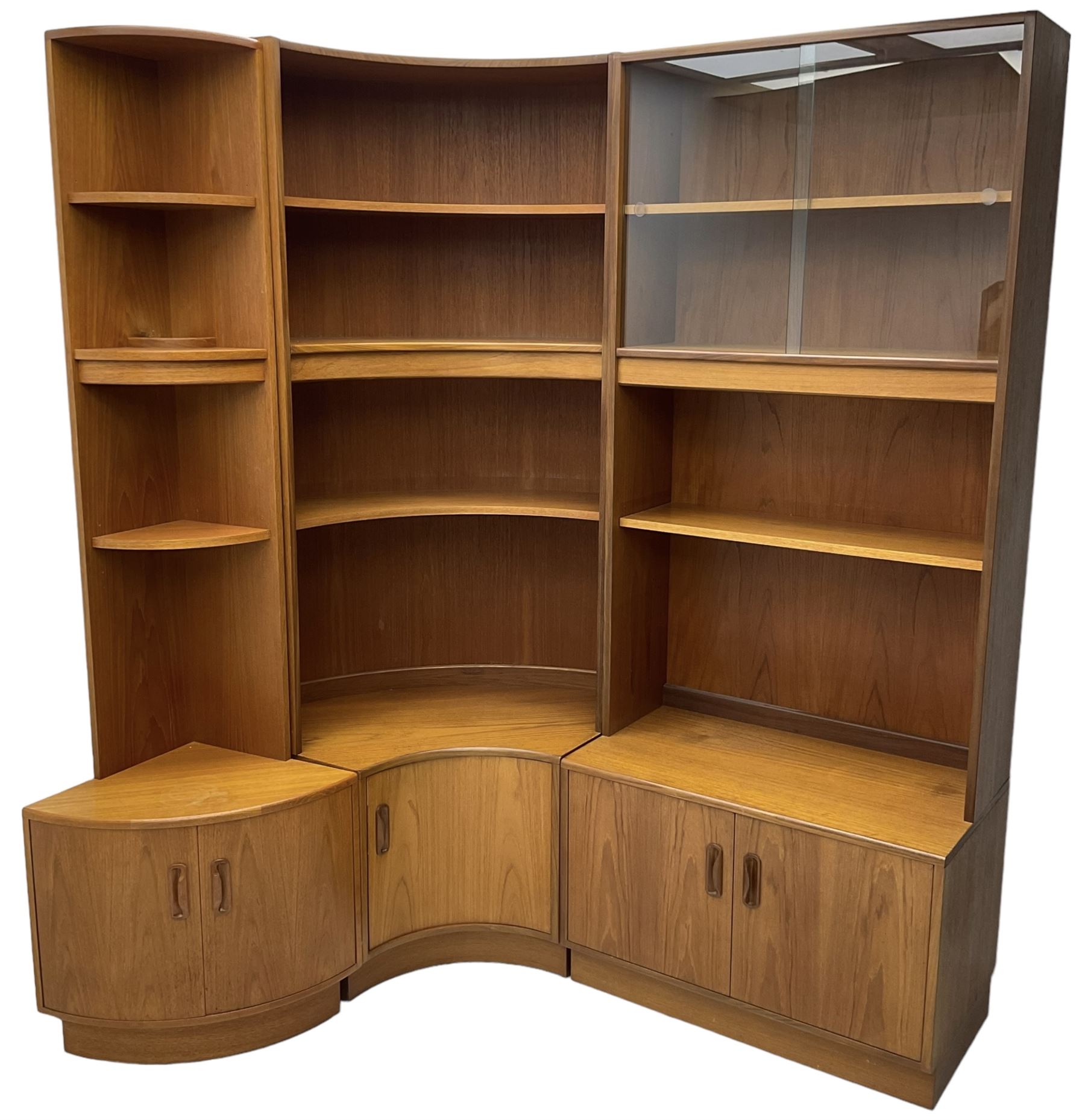 G-Plan - teak three sectional wall unit, fitted with display cabinet enclosed by two sliding glass doors, shelves and cupboards