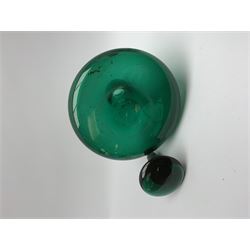 19th century green glass ships decanter with flat topped stopper, H21.5cm, together with a set of four 19th century green glass wine glasses, the funnel bowls upon bladed knopped stems and circular feet, H13cm