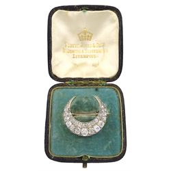 Victorian gold and silver diamond crescent brooch, set with two rows of graduated old cushion cut diamonds, the largest diamond weighing approx 0.40 carat
