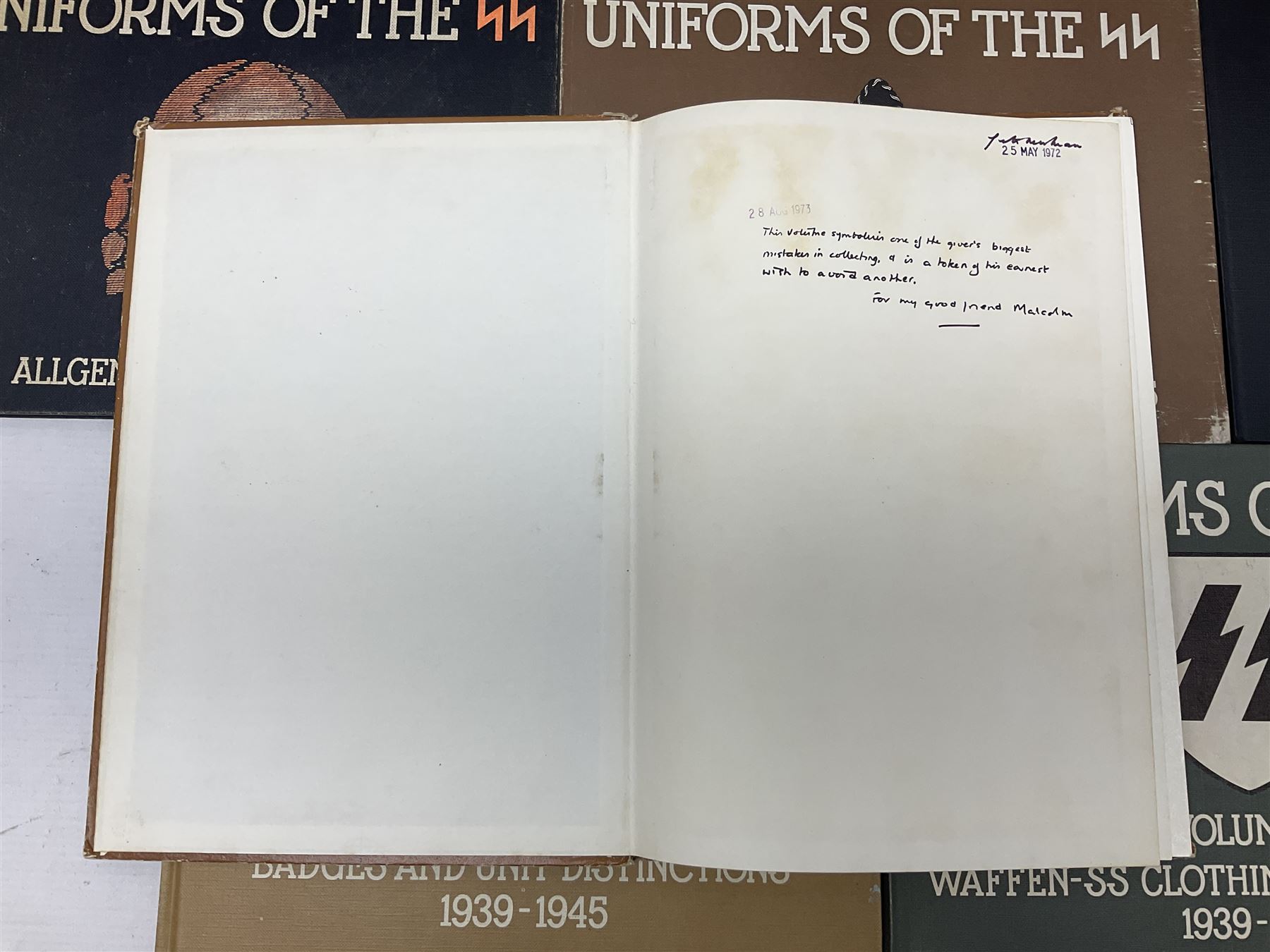 Military Collectors Service: set of three books on WWII German uniforms and badges; and Mollo Andrew: Uniforms of the SS. Volumes 1,4,5,6 & 7 (8)