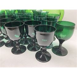 19th century and later green glass drinking glasses, to include several sets, including examples with knopped stems, together with green jug and seven plates