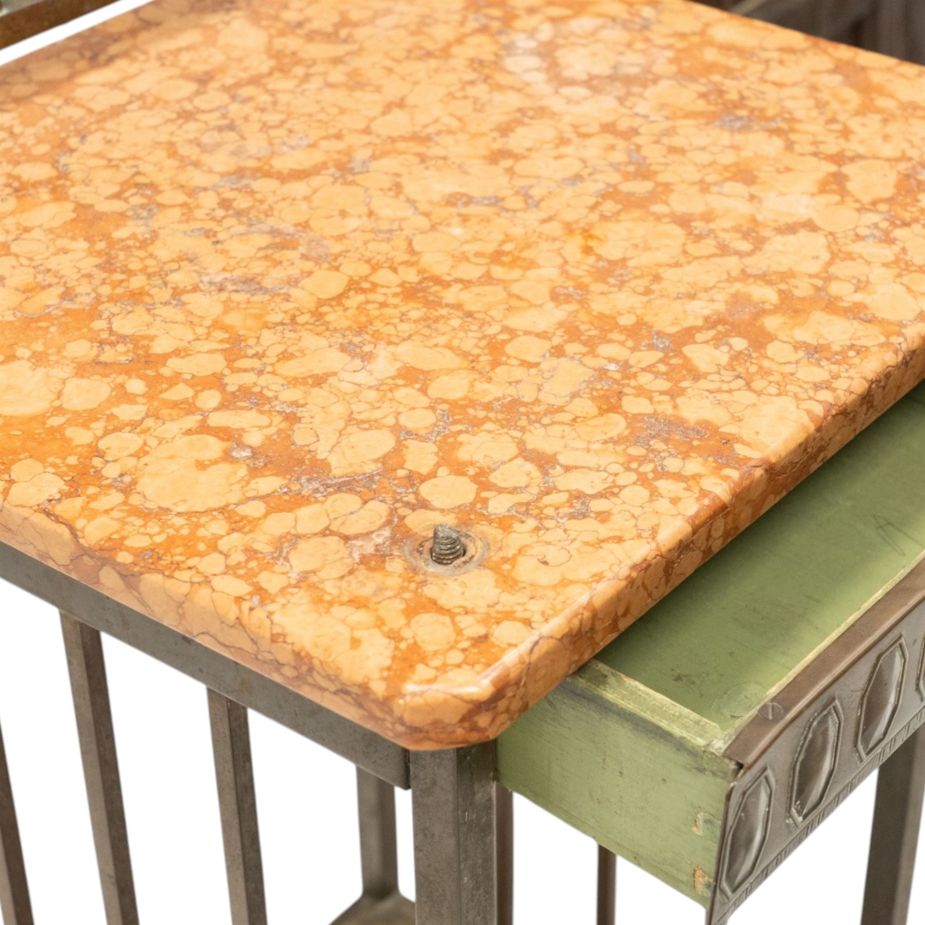 Pair of European Art Deco brass and marble bedside tables, the raised bass back over a canted rectangular marble top, fitted with single drawer decorated with repeating octagonal decoration, raised on square tubular supports with castors, united by undertier