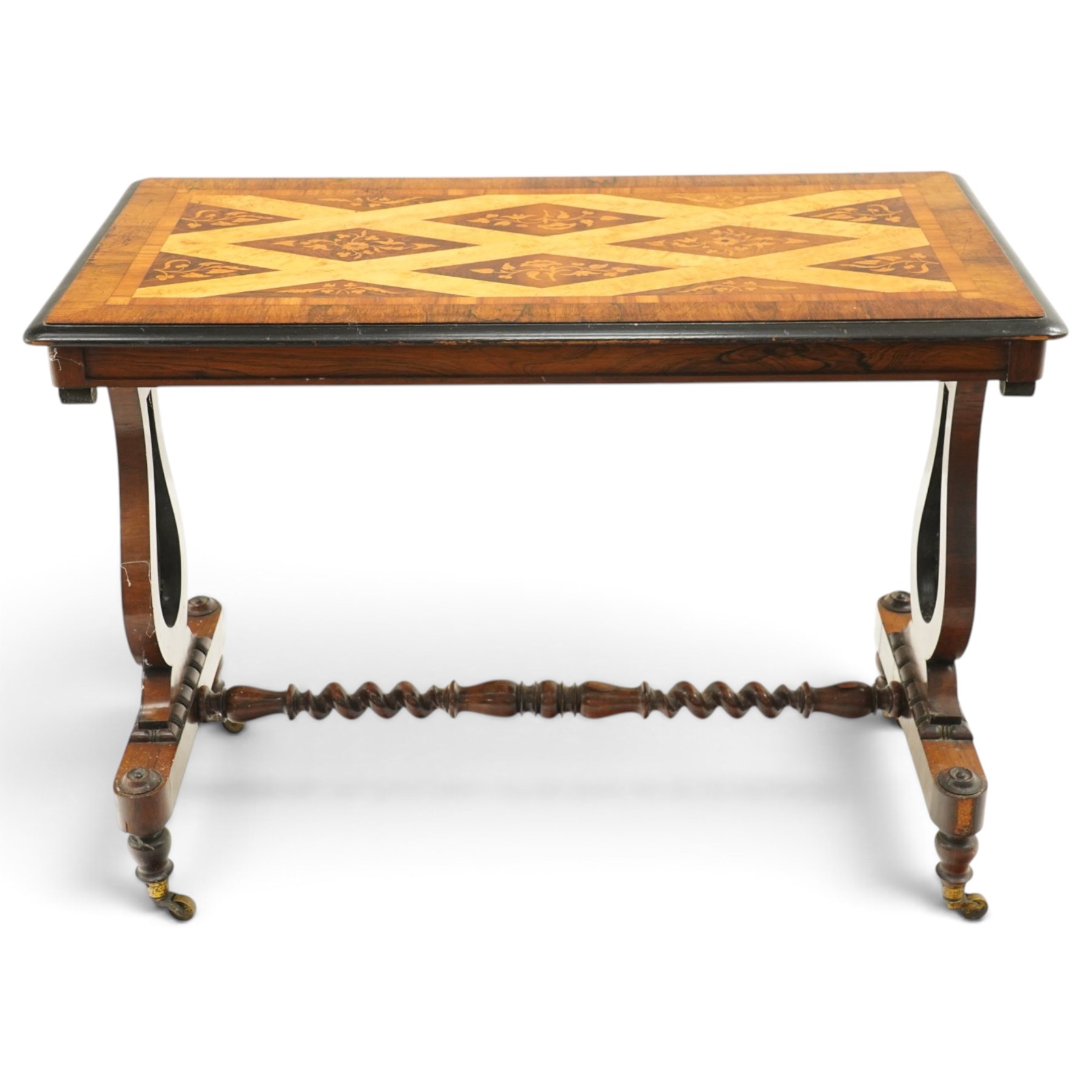Victorian walnut marquetry and parquetry centre table, the rectangular top with floral marquetry and geometric lattice parquetry with ebonised moulded edge, raised on lyre-shaped end supports with pierced floral scrollwork, united by a spiral-turned stretcher, on brass castors