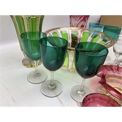 19th century and later glassware, to include ruby glass overlay cup etched with Forget me not and flowers, cut bohemian style bowl with panels of green bordered with gilt foliate patterns, together with a matching vase with petal foot, cranberry glass, two engraved glasses decorated with stars, green glasses etc
flash bohemian style vase