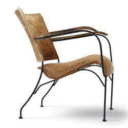 Mid century style cocktail cowhide chair, upholstered in tan cowhide, rectangular back and curved seat with stitched panels and laced borders, shaped wooden armrests on curved black metal supports 