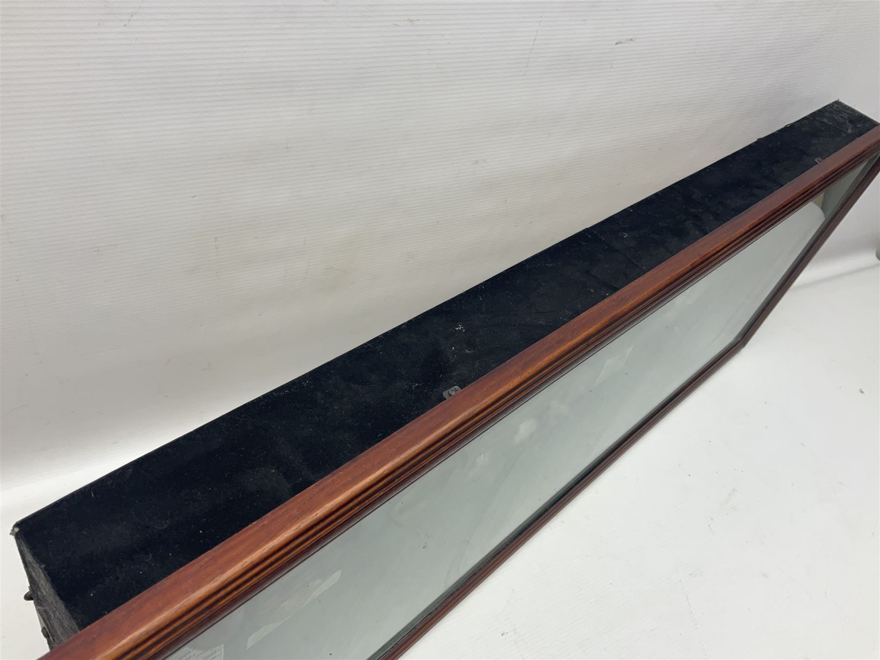 Four framed sporting memorabilia displays, the largest example containing 1930s cricket memorabilia, together with two fishing displays and a football display, each within wooden glazed frames, largest H105cm