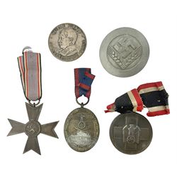 Five WW2 German medals/badges -German Defences West Wall Medal, War merit Cross, Red Cross Decoration, RAD tinnie brooch and Adolf Hitler 1934 medallion (5)