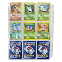 Collection of mainly vintage Pokemon cards including Charizard Base Set Holographic number 4/102 and two Ancient Mew 2000 promo cards, some housed within plastic wallets and some loose