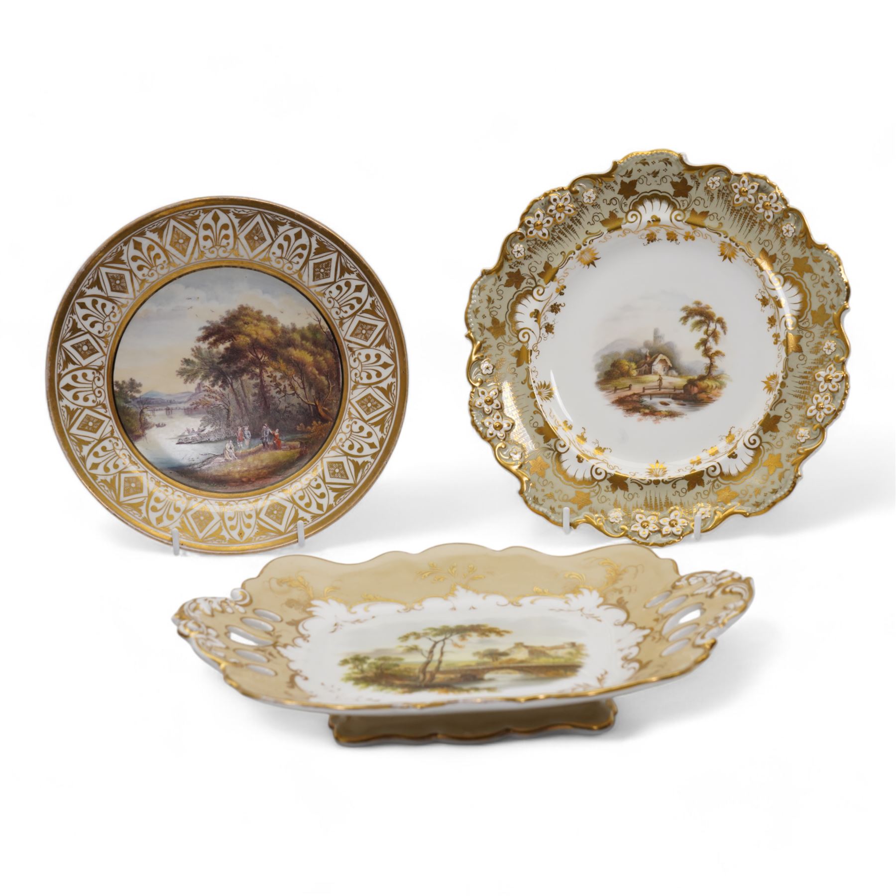 Davenport porcelain dessert plate, painted with a figure and cottage in a rural landscape, within a raised gilt border, D24cm, a 19th century English porcelain twin handled dessert dish, together with an early 19th century porcelain cabinet plate, painted with a river landscape within a gilt border, possibly Derby, unmarked, D22cm (3)