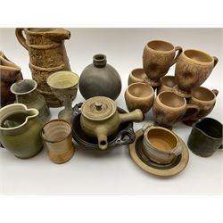 Studio pottery, to include Borgh pottery twin handled bowl, Hillstonia naturalistically modelled jug, set of seven mugs, jug and two vases.