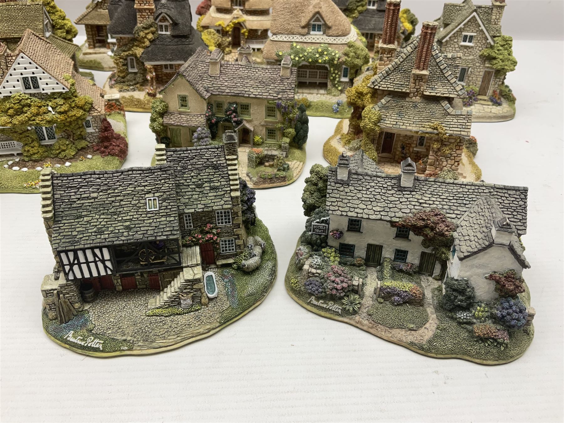 Eight Lilliput Lane limited edition Beatrix Potter models, including Buckle Yeat, Tabitha Twitchits Shop and Ginger Pickles Shop, together with twelve Lilliput Lane models from the Blaise Hamlet collection, including Dial Cottage, Diamond Cottage and Vine Cottage, all with deeds and original boxes (20)
