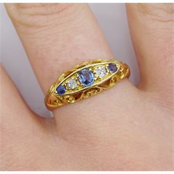 Edwardian 18ct gold three stone sapphire and two stone diamond ring, Birmingham 1907