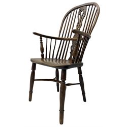 19th century yew wood and elm Windsor chair, high hoop and stick back with pierced splat over dished seat, raised on ring turned supports united by crinoline stretcher