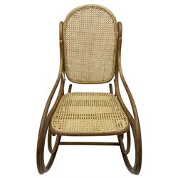 Early 20th century Michael Thonet design bentwood rocking chair, with cane seat and back (W52cm H82cm); Edwardian rocking chair with mauve upholstered back and seat (W43cm H70cm)