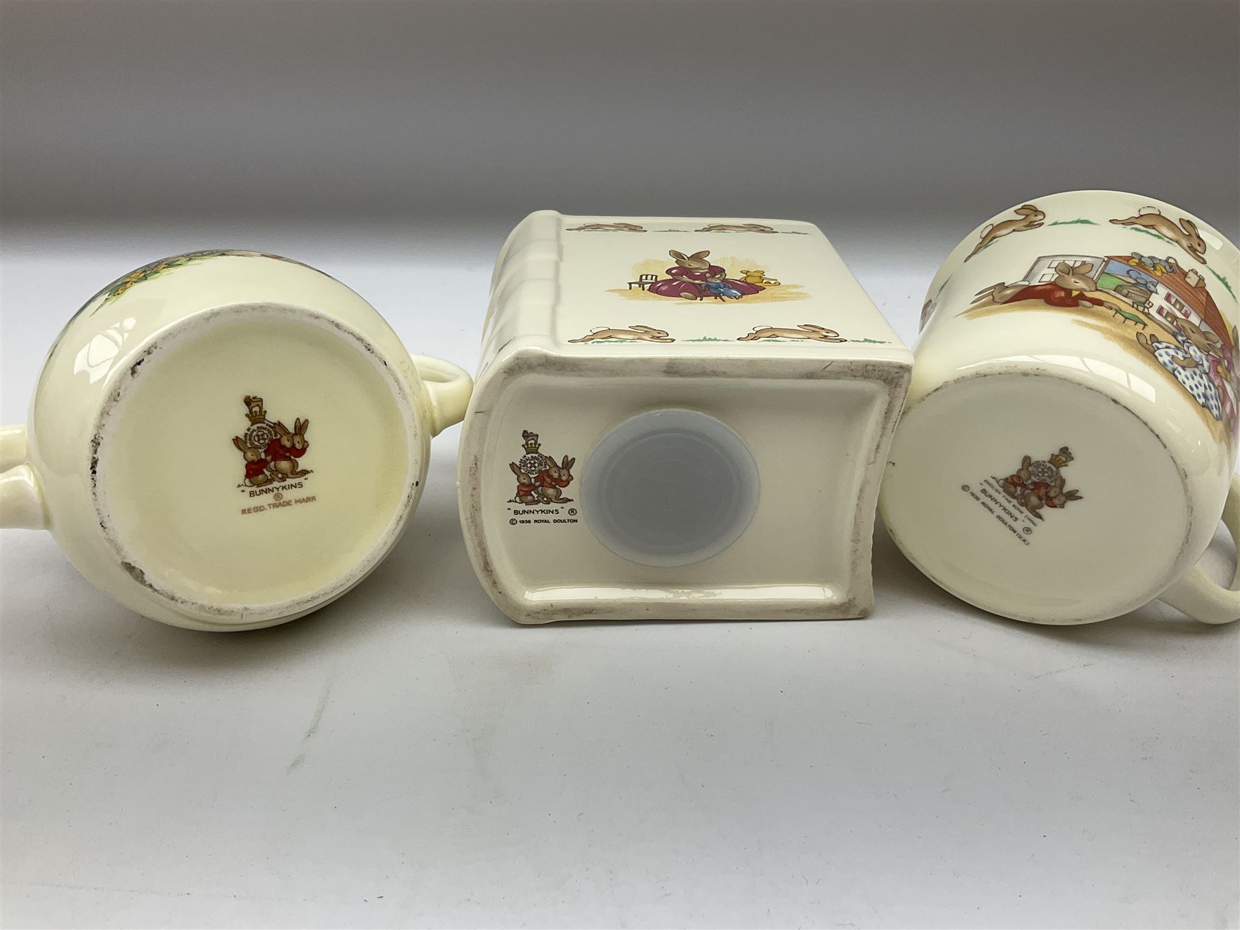 Royal Doulton Bunnykins ceramics, comprising two baby bowls, twin handled cup, two plates, money box, cup, bowl and spoon (9)