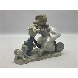 Lladro figure, In No Hurry, modelled as a girl on a tricycle, sculpted by Francisco Polope, with original box, no 5679, year issued 1990, year retired 1994, H15cm