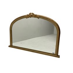 Gilt framed overmantle mirror, the arched plate within framed with repeating beaded decoration and oak leaf pediment with acorn