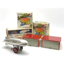Three modern tin-plate toys comprising Schylling Aluminium Airship L24cm; and two Kovap garages with up-and-over doors, all boxed (3)