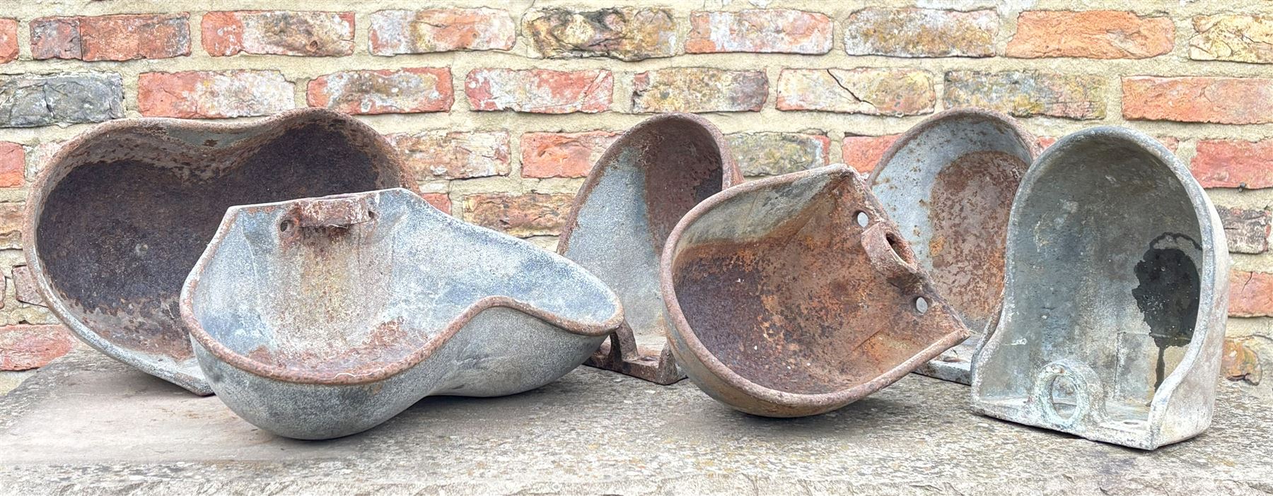 Matched set of six cast iron wall pocket planters. (6) - COLLECTION BY APPOINTMENT FROM: The White House, Thirsk Road, Easingwold, York, YO61 3NF - CALL 01723 507111 TO ARRANGE