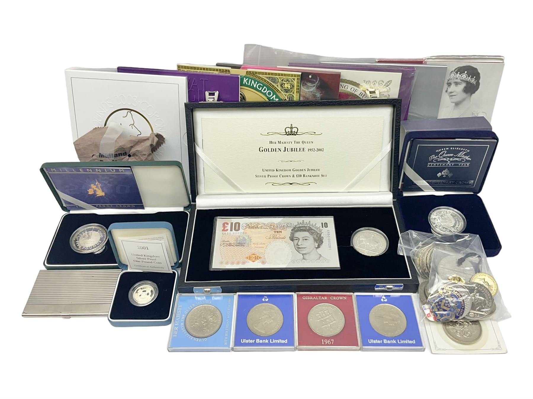 The Royal Mint United Kingdom 'Millennium' silver proof two coin set comprising 1999 and 2000 five pound coins, 2000 'The Queen Mother Centenary Year' silver proof crown, 2001silver proof one pound, 'Her Majesty The Queen Golden Jubilee 1952-2002' silver proof 2002 five pound coin and ten pound banknote set, all being cased with certificates, United Kingdom 1999 brilliant uncirculated coin collection in card folder, other commemorative coinage etc