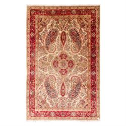 West Central Persian Sarouk hand-knotted carpet, ivory field with central ornate medallion...