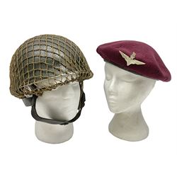 WW2 British Airborne Troops/Paratroopers Steel Helmet with green textured paint finish and netting cover, leather and sponge liner and three point chinstrap mounting; liner marked BMB 1943; together with a paratrooper's maroon beret with metal badge (2)