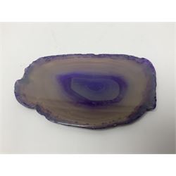 Four purple agate slices of various sizes, polished with rough edges