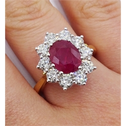  18ct gold oval ruby and round brilliant cut diamond cluster ring, hallmarked, ruby 2.25 carat, total diamond weight 1.50 carat  
[image code: 4mc]
