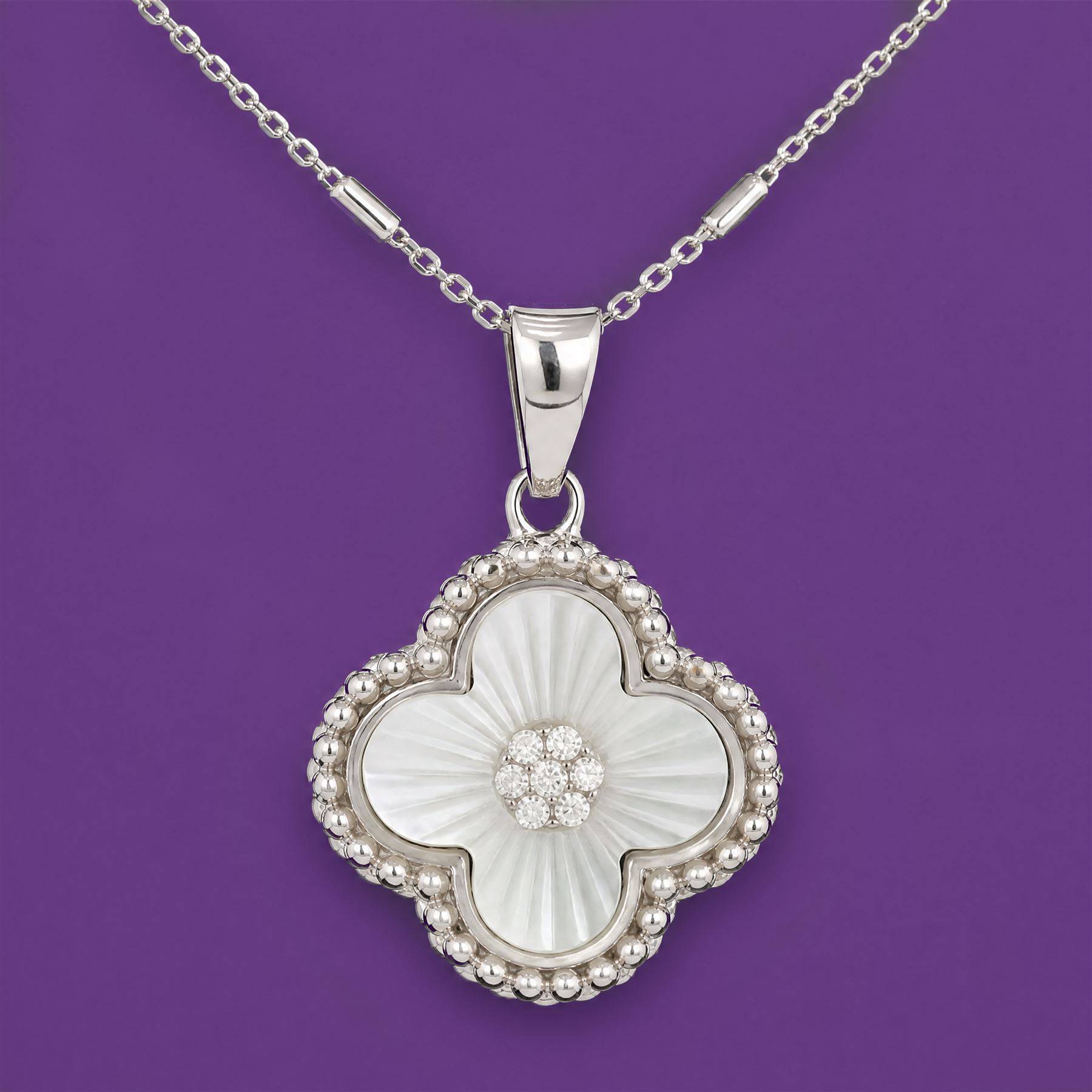 Silver cubic zirconia and mother of pearl flower head pendant necklace, stamped 925