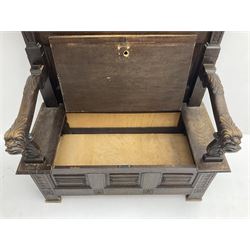 19th century and later carved oak hall bench or settle, the projecting moulded canopy top over triple panelled back, the back carved with masks, roundels and linenfolds, acanthus scroll carved arms with grotesque head terminals, hinged box seat over panelled front