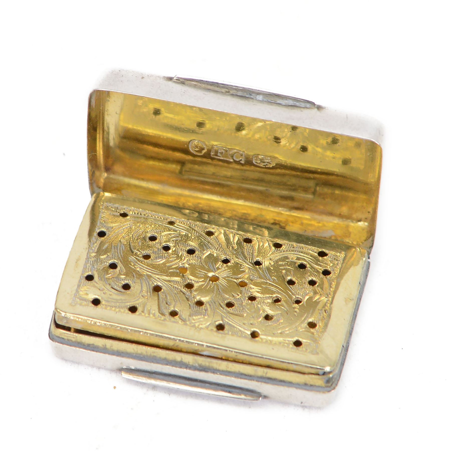 William IV silver vinaigrette, of rectangular form with engine turned decoration to hinged cover, opening to reveal gilt interior with engraved hinged compartment, hallmarked Francis Clark, Birmingham 1838, L3.5cm