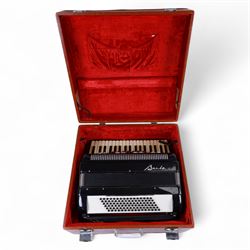 Bai-Le-20th century Chinese Piano Accordion, three octave keyboard with 96 treble buttons and 7 base keys, 16-fold bellows with shoulder straps and hard carrying case.