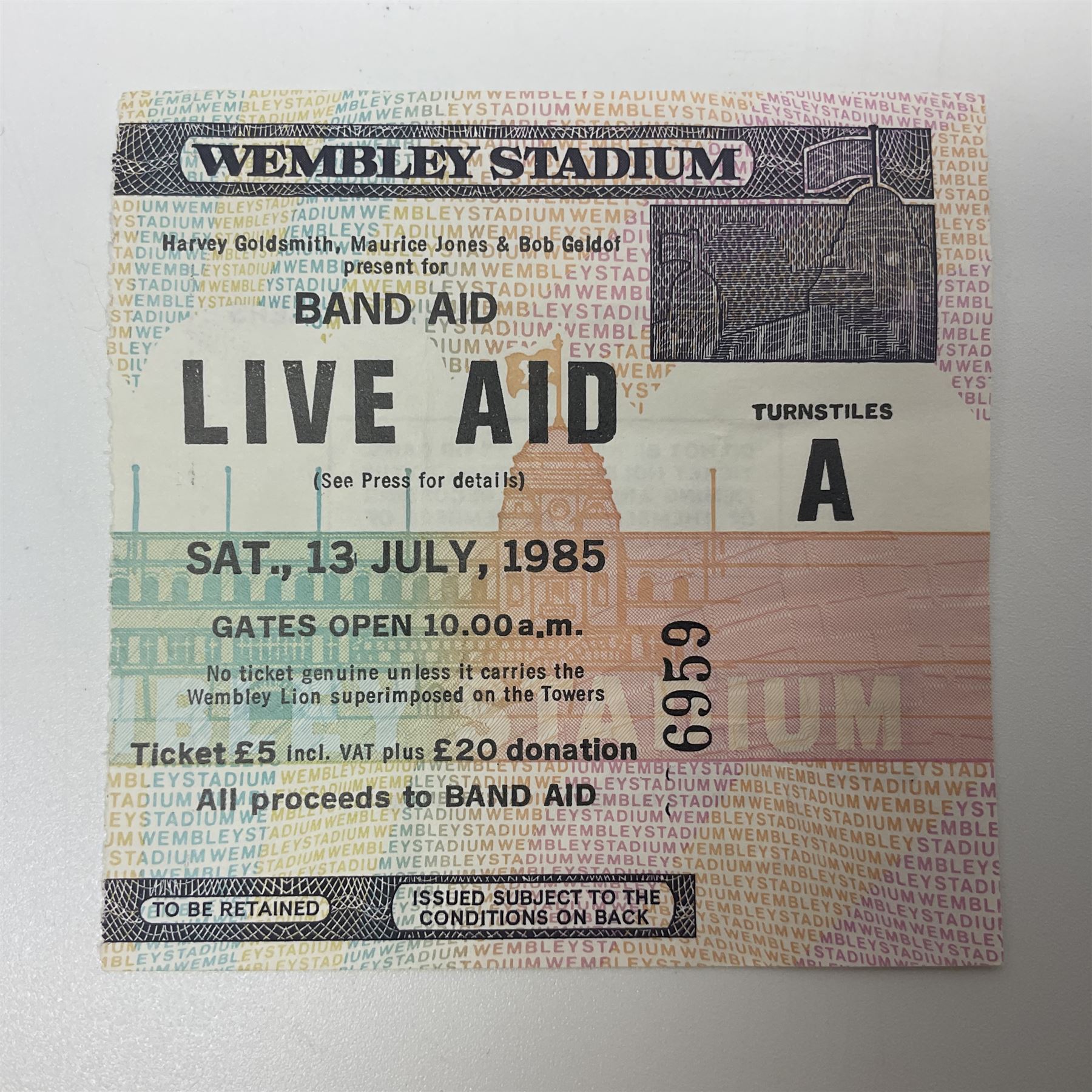 Live Aid memorabilia 13th July 1985 Wembley Stadium - Official Programme with ticket; and The Global Juke Box T-shirt